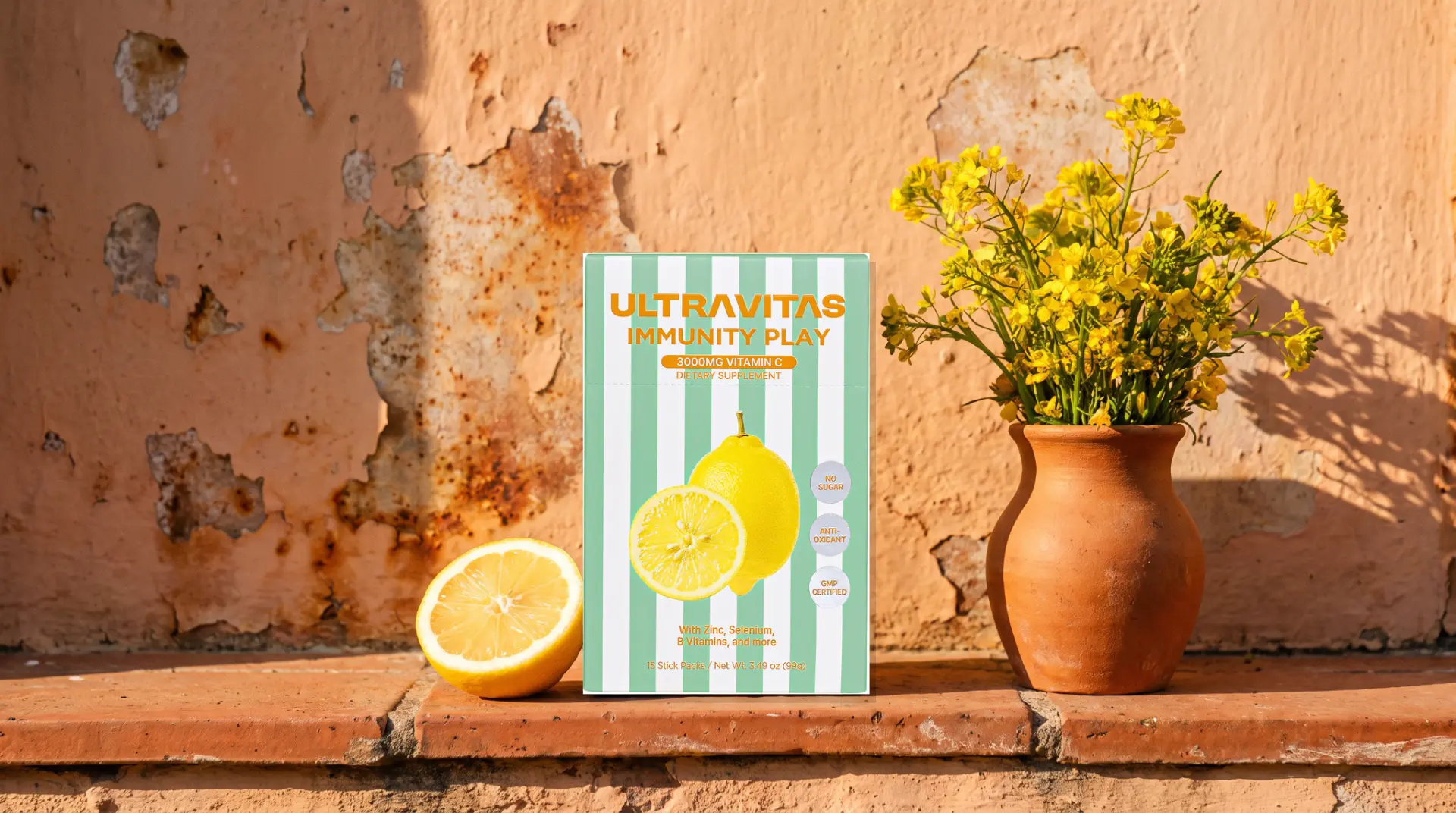 UltraVitas Immunity Play lemon-flavored ultra-dose vitamin C powder sticks beside lemon and yellow flowers.